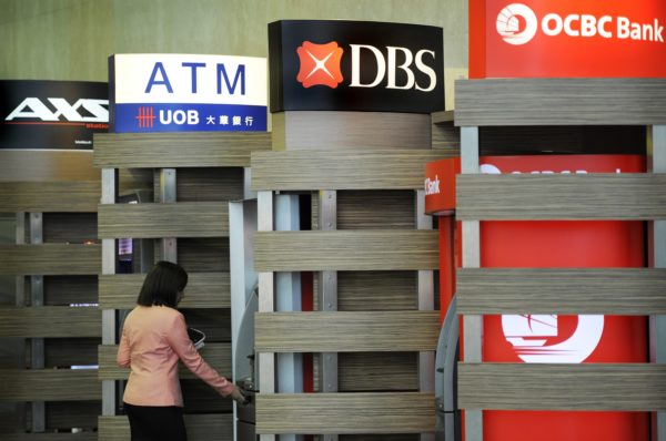 Shares of Singapore banks jump after regulator lifts dividend cap