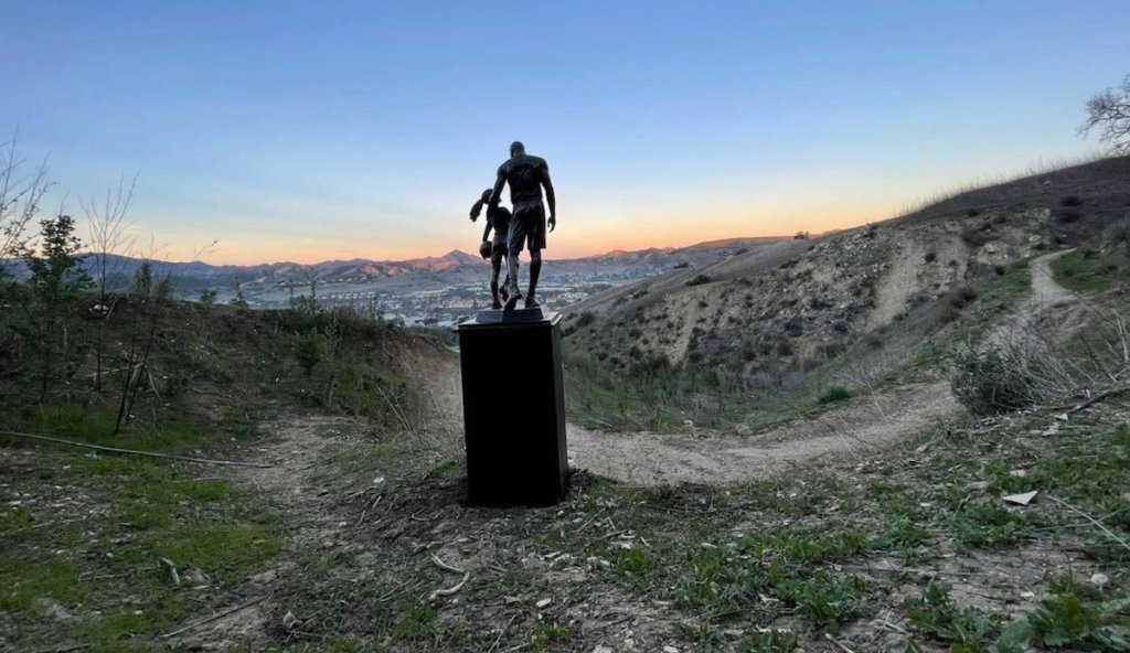 A sculpture of Kobe and Gianna Bryant is pictured Jan. 26, 2022 at the site of the helicopter crash that killed nine people.