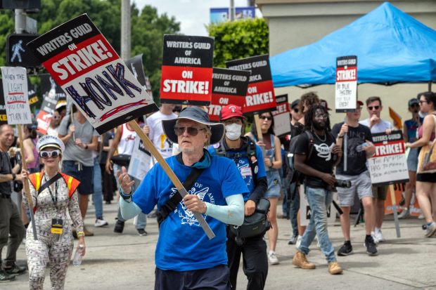 Members and supporters of SAG-AFTRA and the WGA picket outside of Paramount Studios on Wednesday, Aug, 9, 2023. It is the 100th day of the Writers Guild of America strike. (Photo by Hans Gutknecht, Los Angeles Daily News/SCNG)