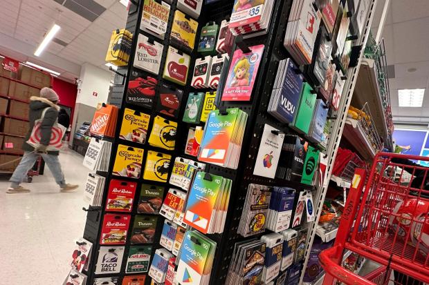 Gift cards are displayed at a Target store, in New York, Thursday, Dec. 21, 2023. Americans are expected to spend nearly $30 billion on gift cards this holiday season, according to the National Retail Federation. Restaurant gift cards are the most popular, making up one-third of those sales. (AP Photo/Richard Drew)