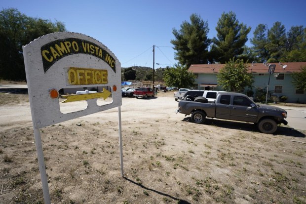 A sign points to a rental office in the Campo community, which is listed for sale near the border with Mexico. (Alejandro Tamayo, San Diego Union-Tribune)